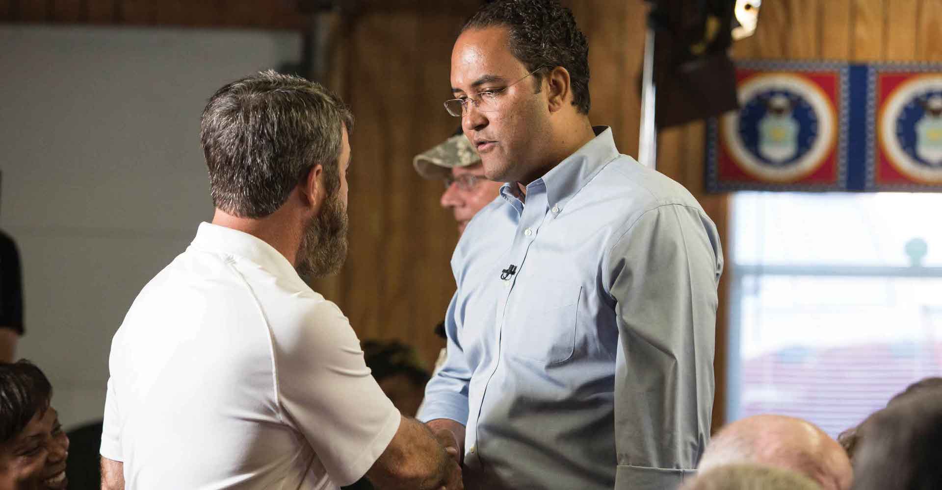 Will Hurd is shaking hands during the meeting