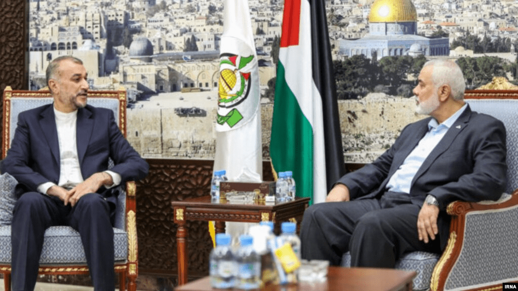 Photo: Iranian Foreign Minister Hossein Amirabdollahian (left) meets with the leader of the Palestinian militant group Hamas, Ismail Haniyeh, in Doha on October 13.